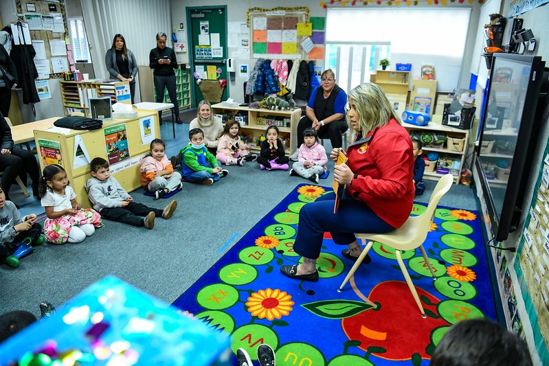 Senator Caroline Menjivar reading book to children at a 2023 Head Start visit. 