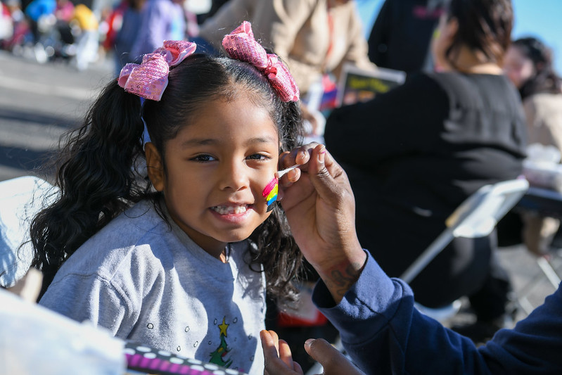 A child getting her face painted at 2023 Victorville Play Day. 